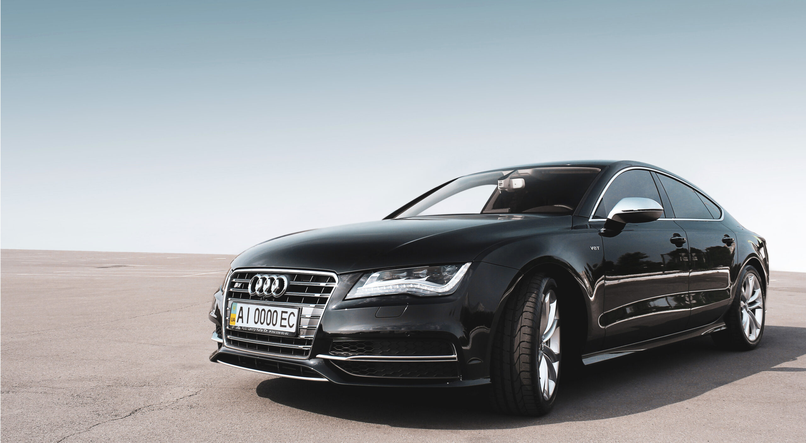 A black audi in an empty surrounding