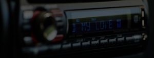 a darkened photo of a car radio