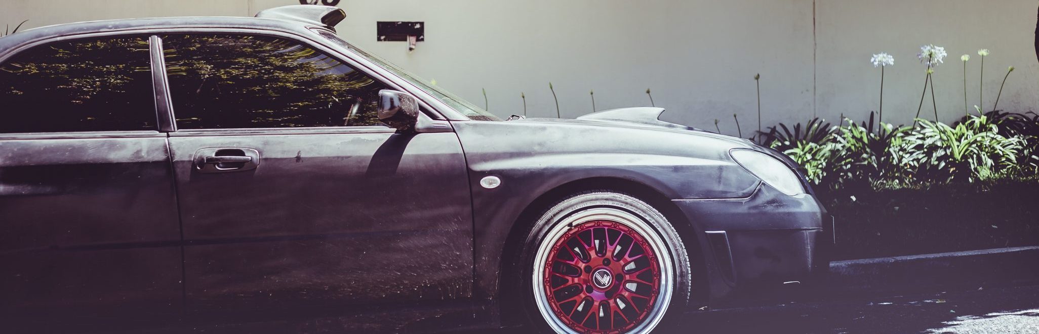 tinted windows on a modified car street racer car with tinted windows