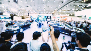 Crowd enjoying and taking picture at the car show