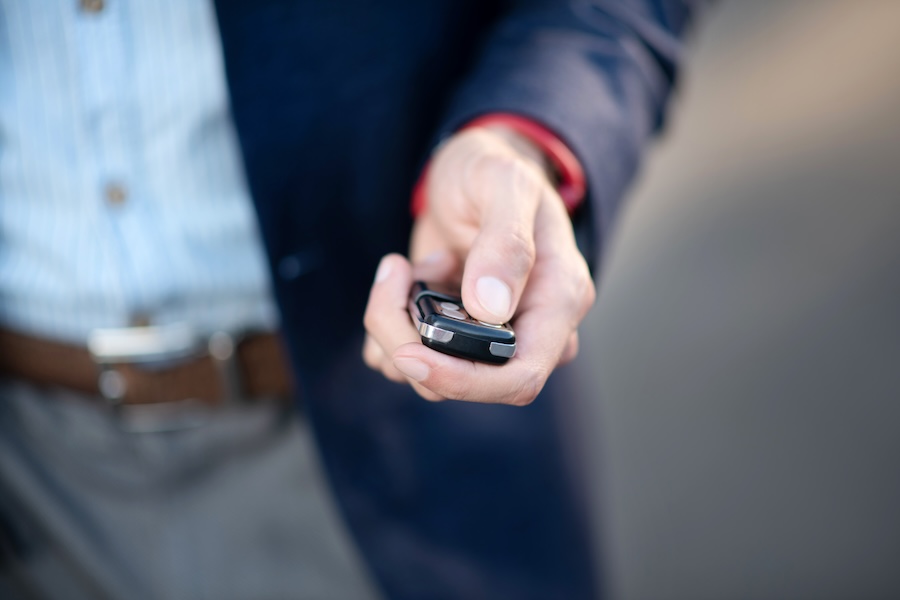 Man using his car remote starter